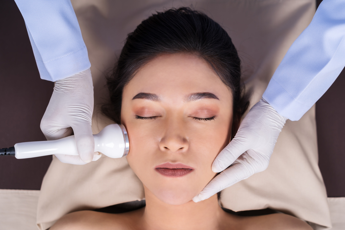 woman receiving ultrasound facial beauty treatment skin care